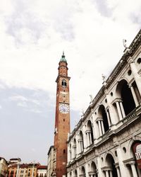 Low angle view of clock tower against sky