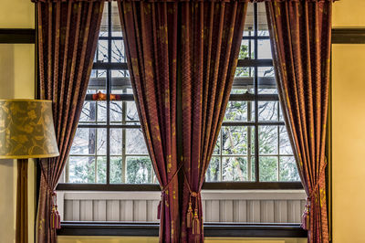 Low angle view of building seen through window