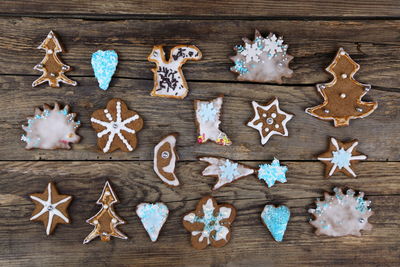 High angle view of christmas cookies on wooden table