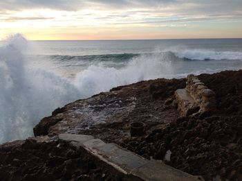 Scenic view of sea against dramatic sky