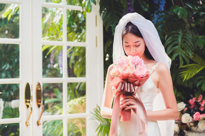 Beautiful bride with flower bouquet