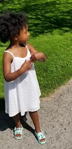 Full length of woman standing on field