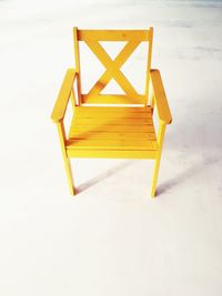 Close-up of chair on beach