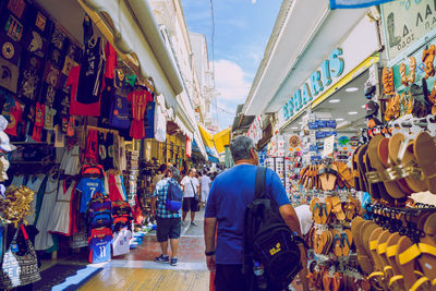 Rear view of people at market stall