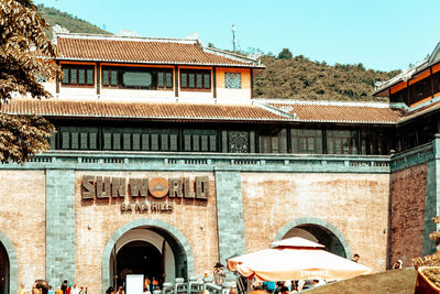 People in front of historic building