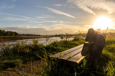 Scenic view of lake against sky during sunset