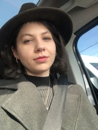 Portrait of a young woman in a car