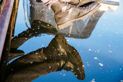 Low section of person on wet rock