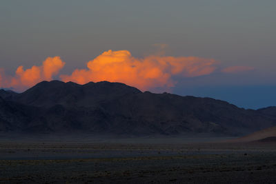 Scenic view of mountains against sky during sunset