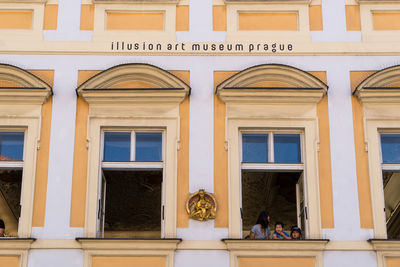 Reflection of building on glass window