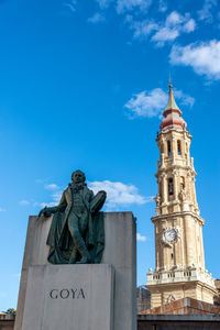 Low angle view of statue against blue sky