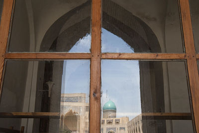 View of mosque seen through window