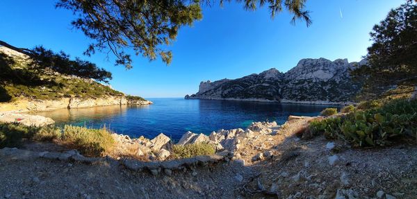 Scenic view of sea against clear blue sky