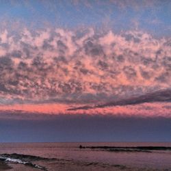 Scenic view of sea against sky at sunset