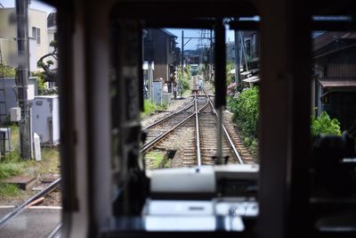 Train on railroad track against sky