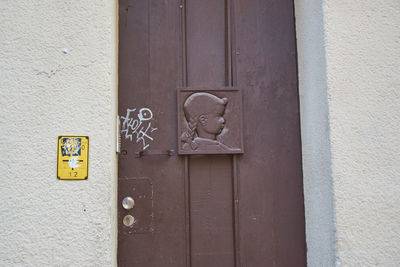 Close-up of text on closed door