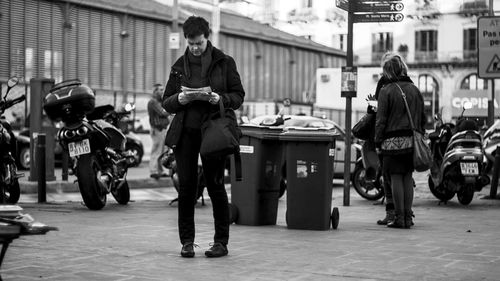 Man standing on city street