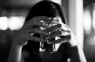 Close-up of cropped hand holding plant