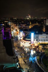 High angle view of illuminated buildings in city at night