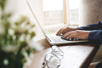 Man using laptop on table