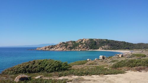 Scenic view of sea against clear blue sky