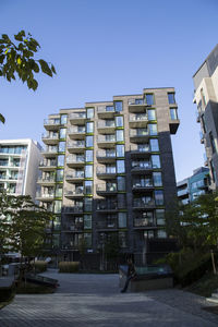 Low angle view of buildings against clear blue sky