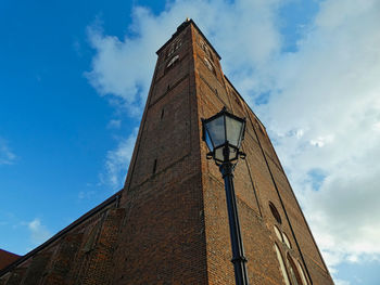 Low angle view of clock tower against sky