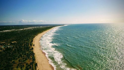 Scenic view of beach on sunny day