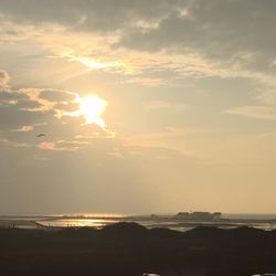 Scenic view of beach at sunset