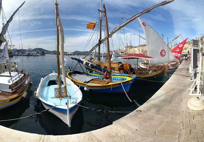 Boats moored at harbor