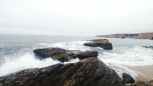 Scenic view of sea against clear sky