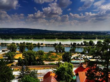 High angle view of trees and buildings against sky
