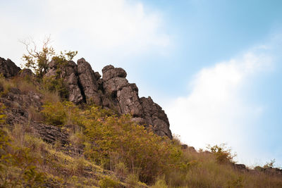 Low angle view of rocks against sky