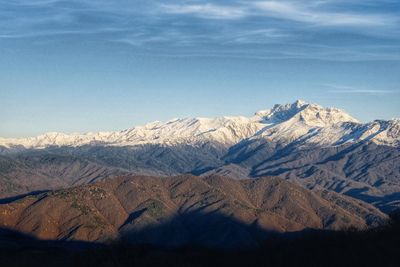 Scenic view of snowcapped mountains against sky