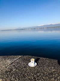 Scenic view of sea against clear blue sky