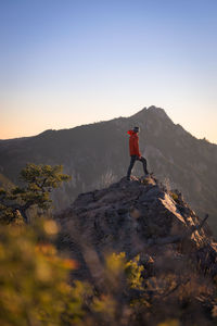 Rear view of man walking on mountain