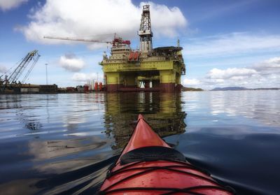 Cropped image of kayak on sea against sky