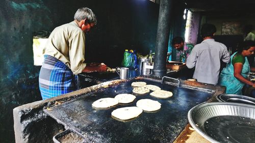 People working at market stall