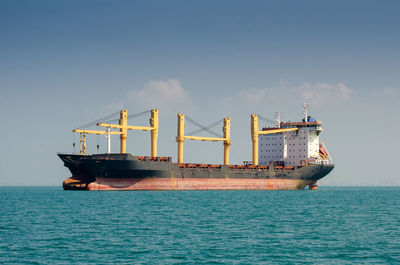 View of ship in sea against sky