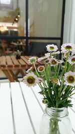 Close-up of white flower vase on table