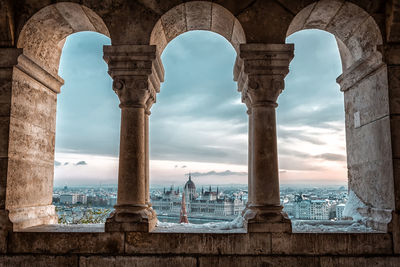 Panoramic view of budapest through the windows of the fisherman's bastion at dawn in winter