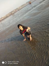 Full length of boy on sand at beach