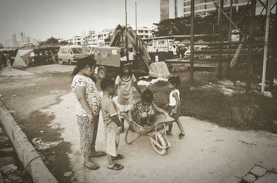 People on street against sky