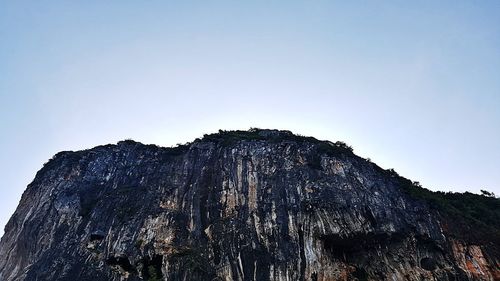 Low angle view of rock formation against sky