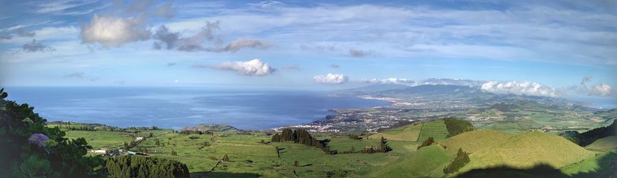 Panoramic view of landscape and sea against sky