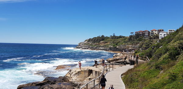 Scenic view of sea against clear blue sky