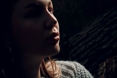 Close-up portrait of a woman looking away