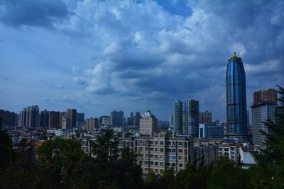 Modern buildings in city against sky