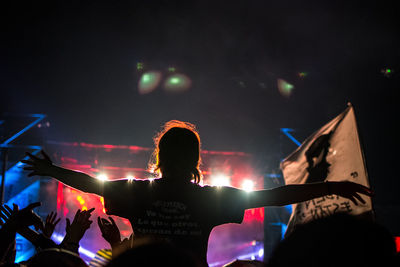 People enjoying music concert at night