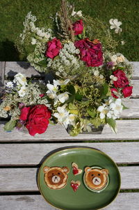 Directly above shot of various flowers in vase on table